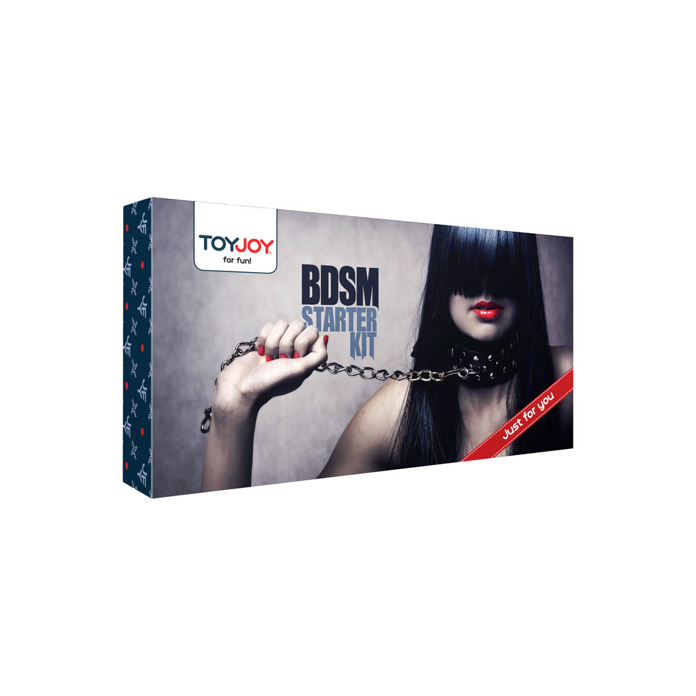 ToyJoy BDSM Starter Kit box featuring a woman with a studded collar and a chain. Let's play!