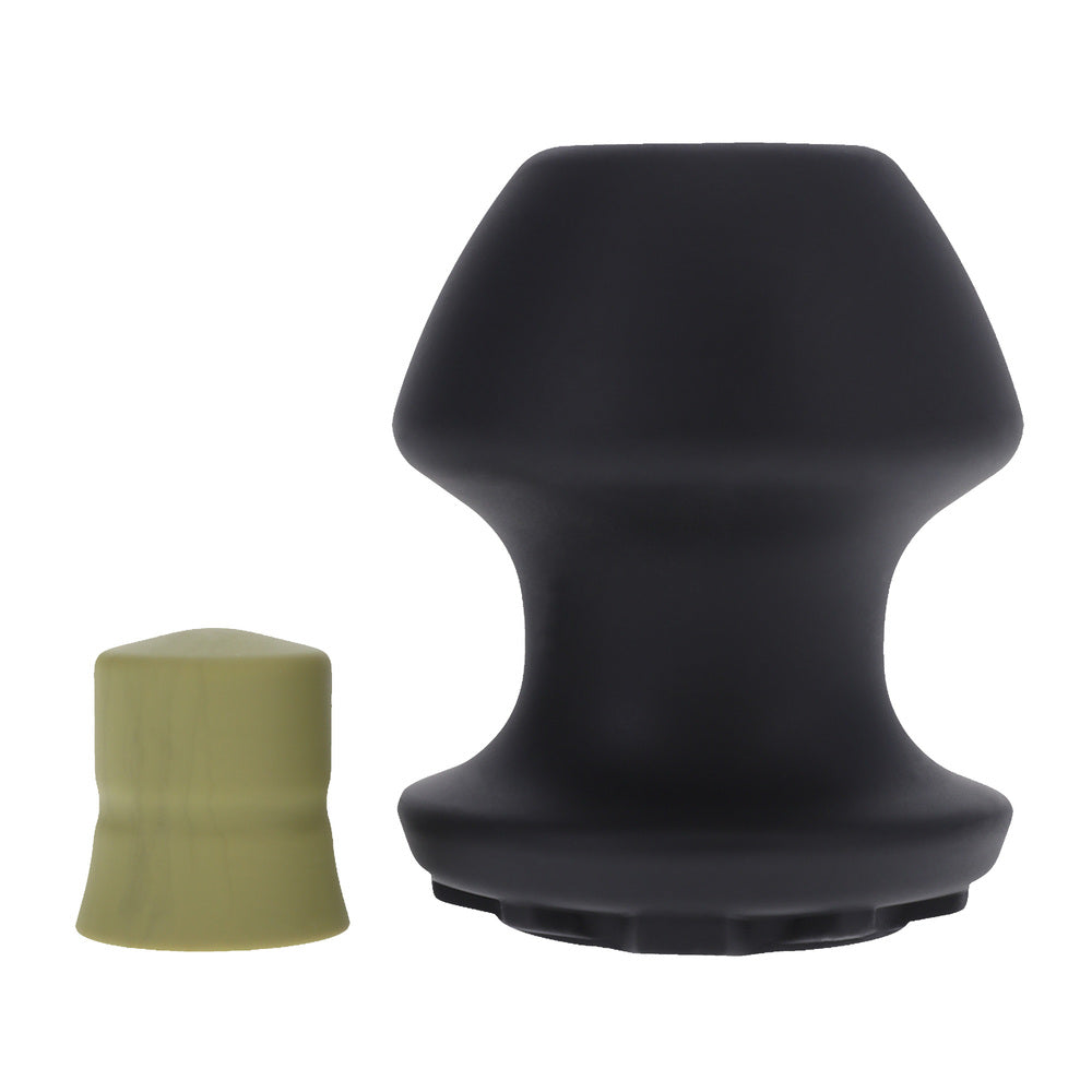 Doc Johnson Kum Keeper large black, with smaller beige insert.