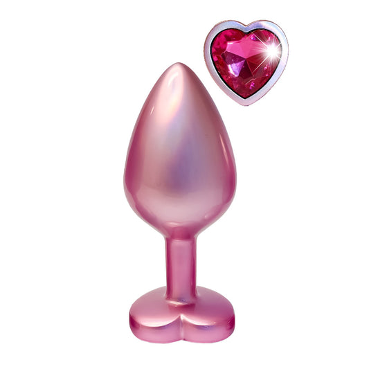 Pearl pink anal plug with heart jewel detail.