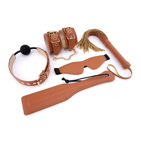 Elite BDSM Cognac Vegan Leather Set from Dream Toys: paddle, whip, gag, cuffs, and blindfold.