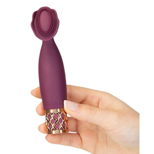 Purple mini massager held in hand