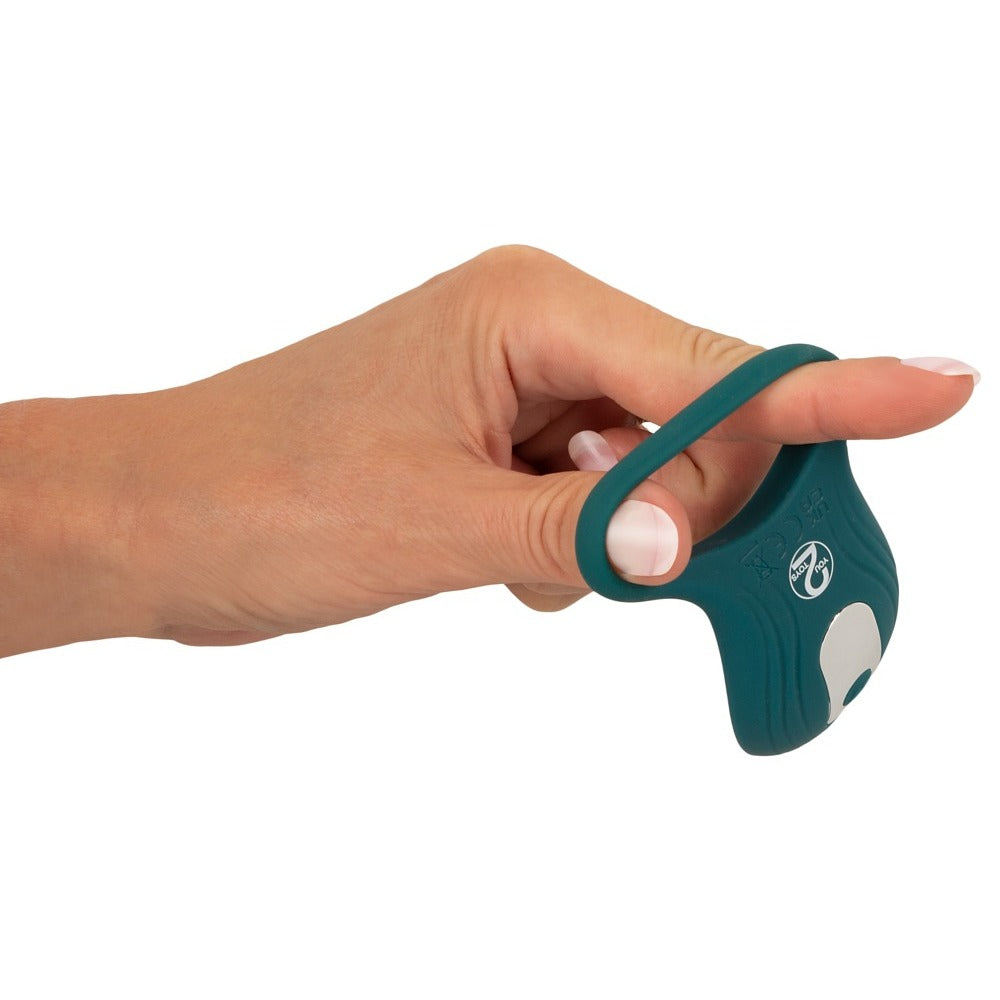 Teal You2Toys vibrator held on finger.