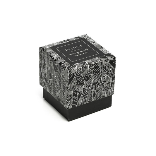 Je Joue Jasmine & Lily massage candle in its elegant black and white patterned box.