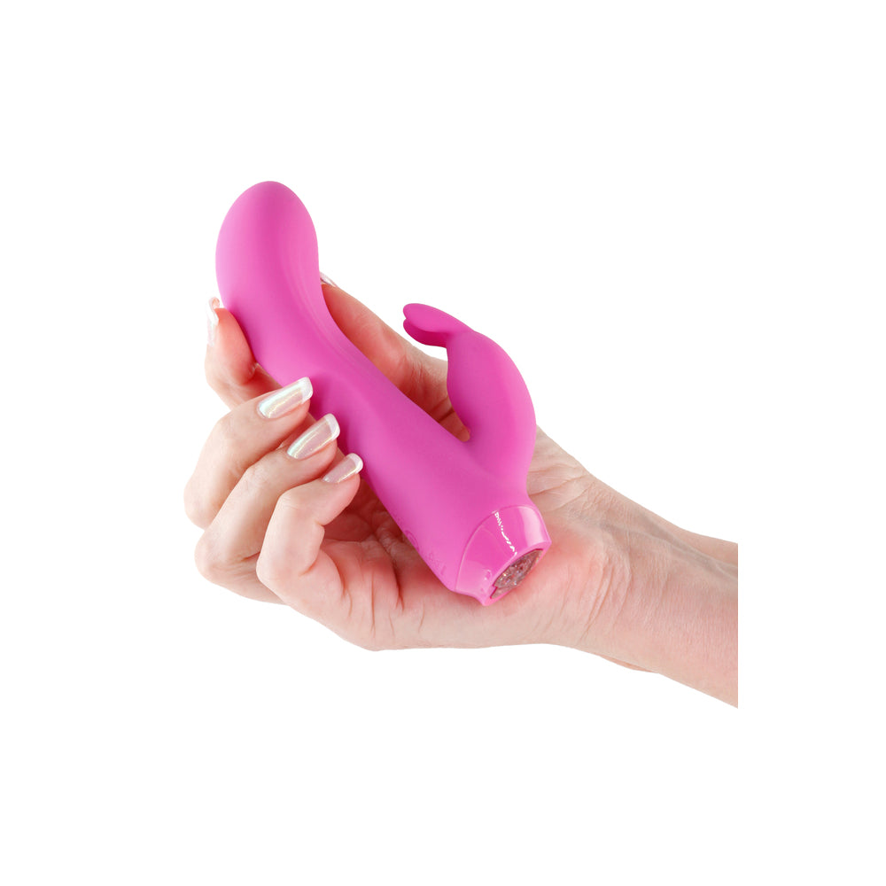 Pink rabbit vibrator held in hand.