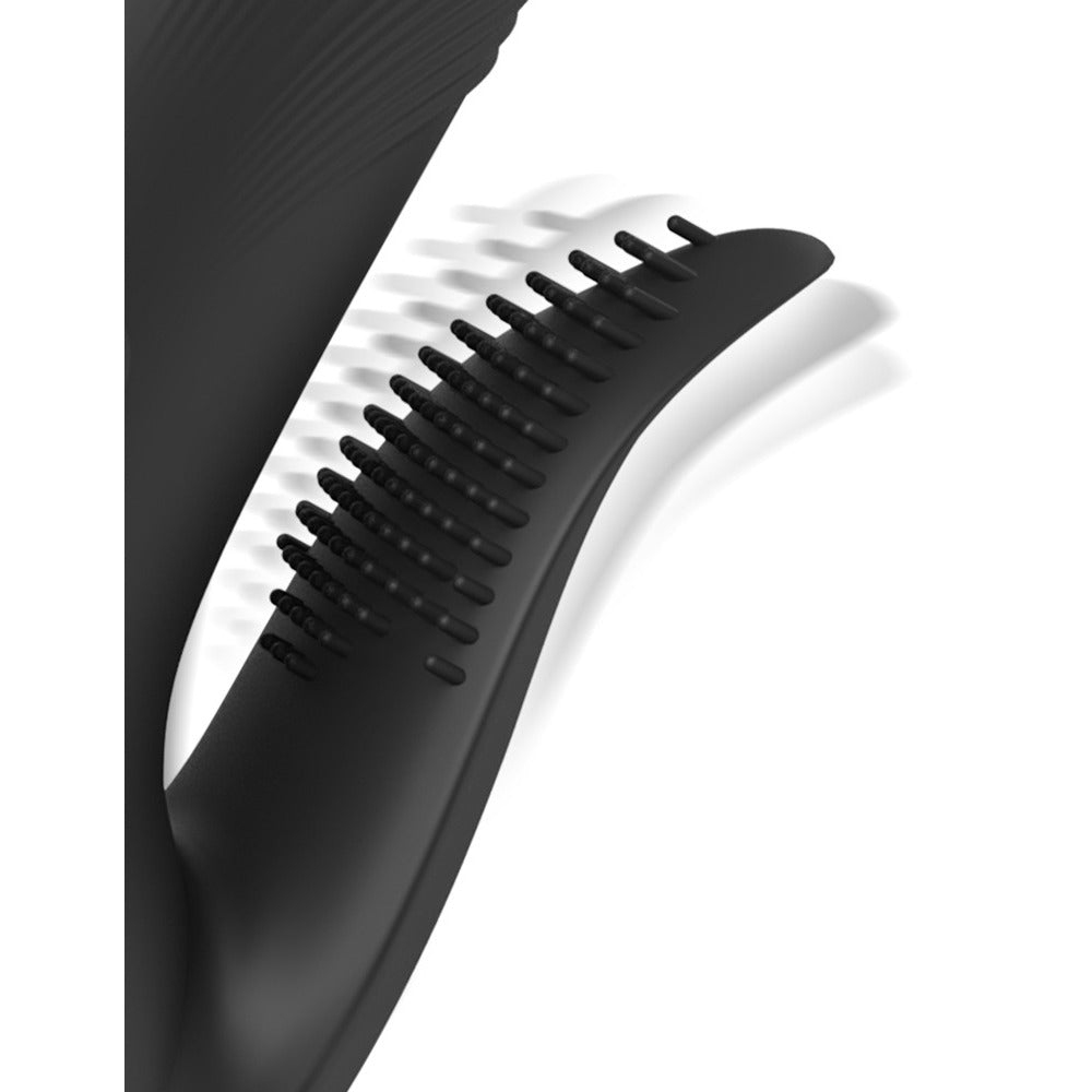 Close-up of a black vibrator with textured pogo tip.