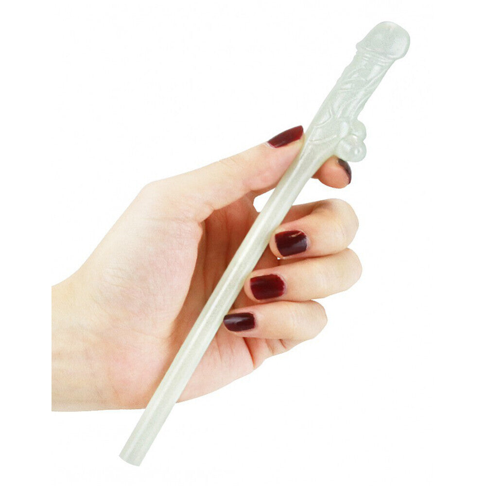 Cheeky willy-shaped glow-in-the-dark novelty drinking straw being held.