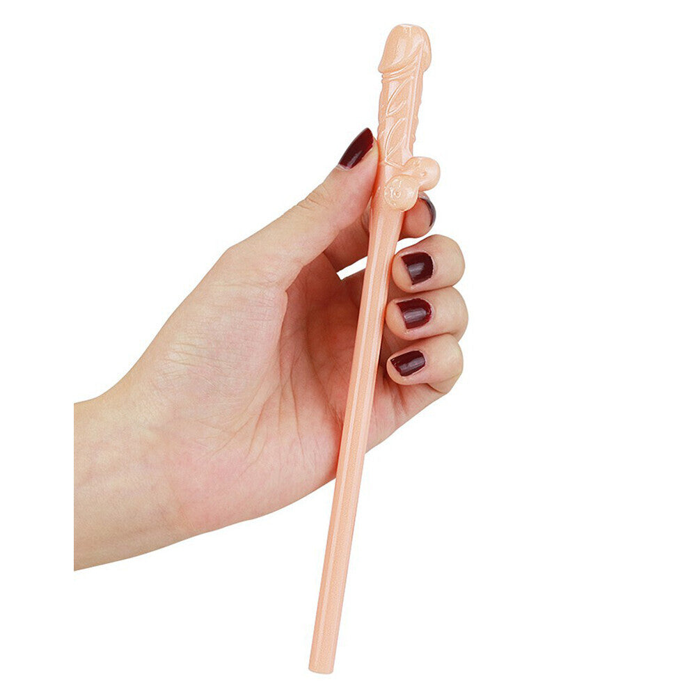Hand holding a pink willy straw.