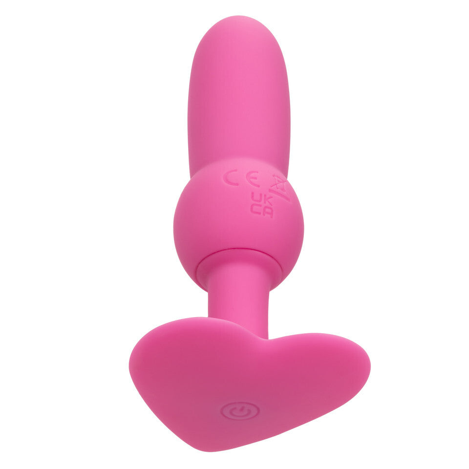 Pink vibrating beaded probe toy with heart-shaped base