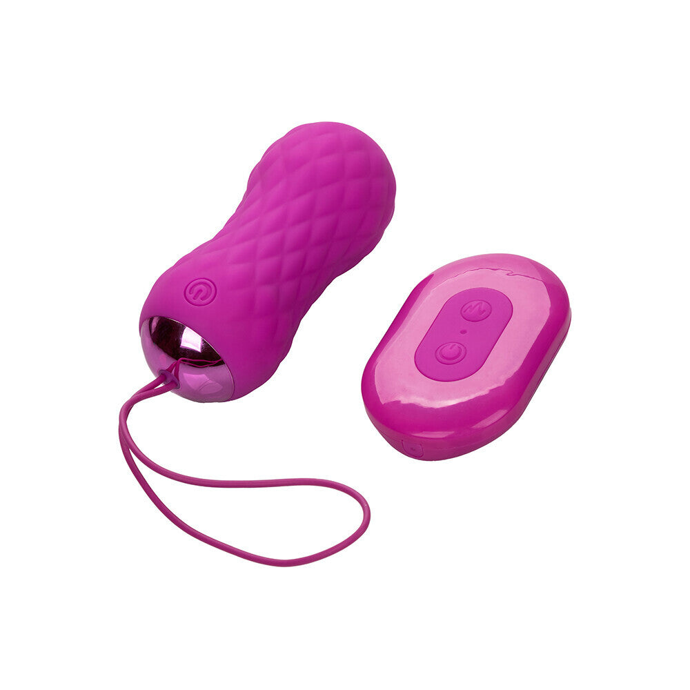 Textured pink bullet vibrator with a remote control