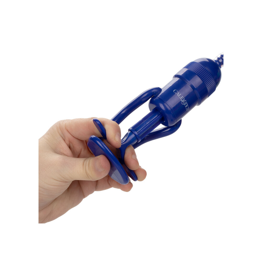 Hand grips a royal blue pump, ready for a bit of adventurous fun. A playful promise of enhanced pleasure.