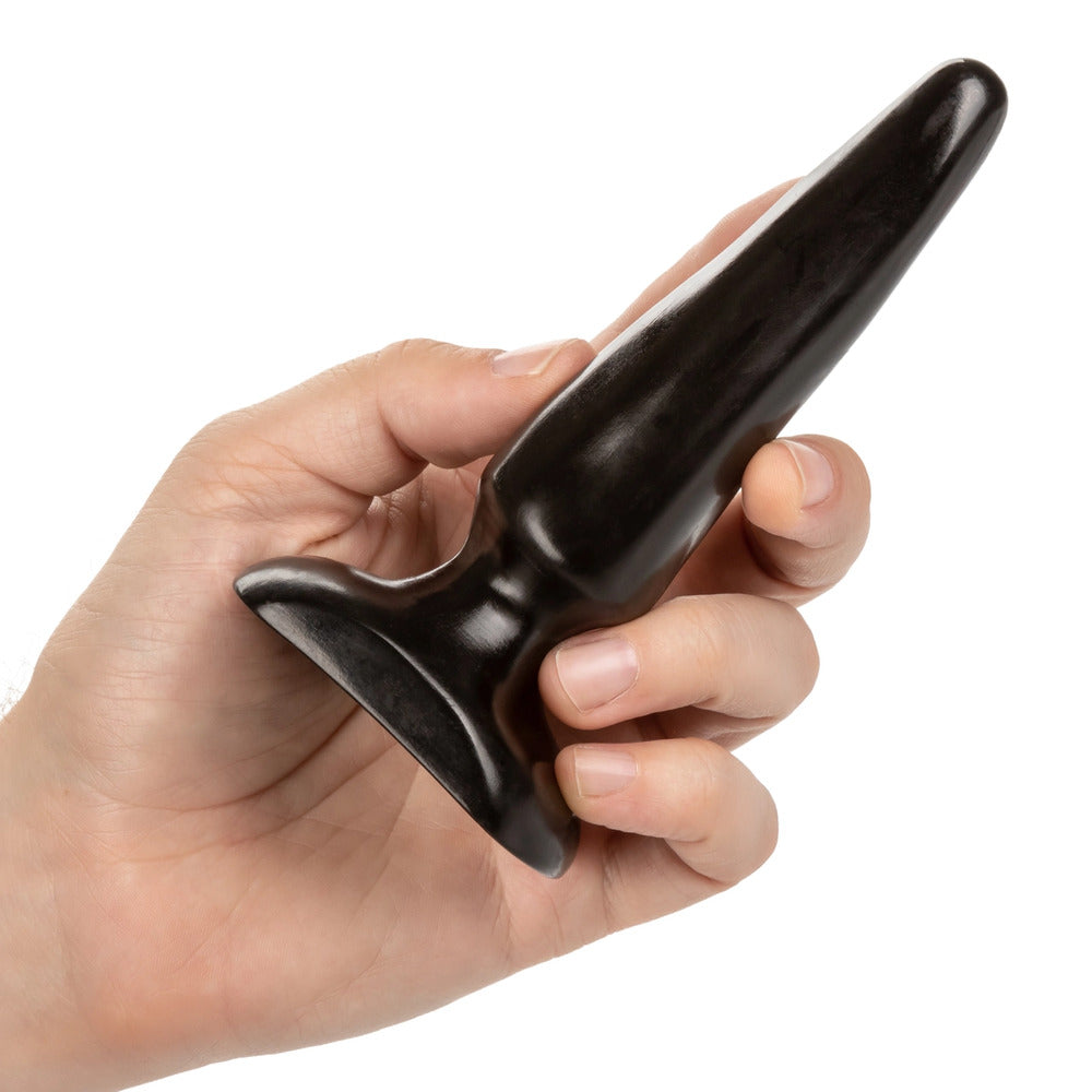 Black butt plug held in hand