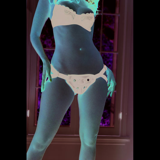 Woman in bra and strap-on harness