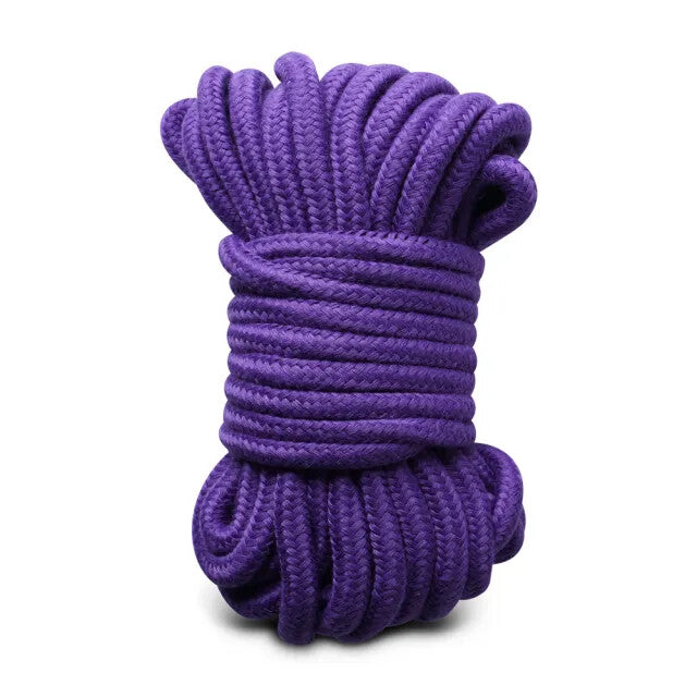 Indulge playful surrender: purple cotton rope coils, dreams bound only by your imagination.