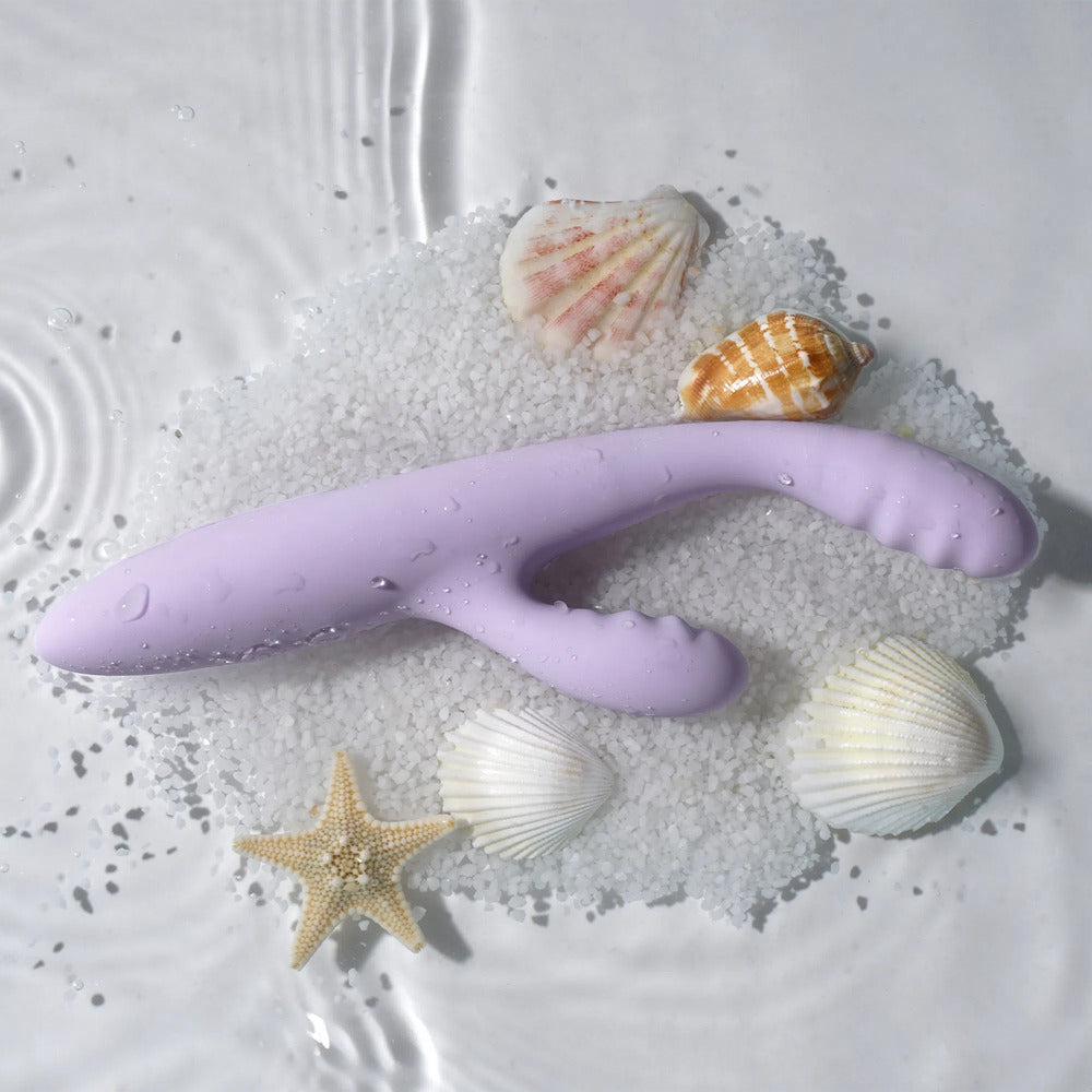 Lilac Svakom CICI Slim G-Spot Rabbit Vibrator with sea shells and a starfish.