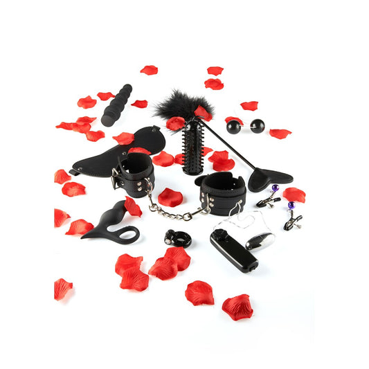 ToyJoy's pleasure sex toy kit with cuffs, whip, anal beads, and red petals for romantic play.