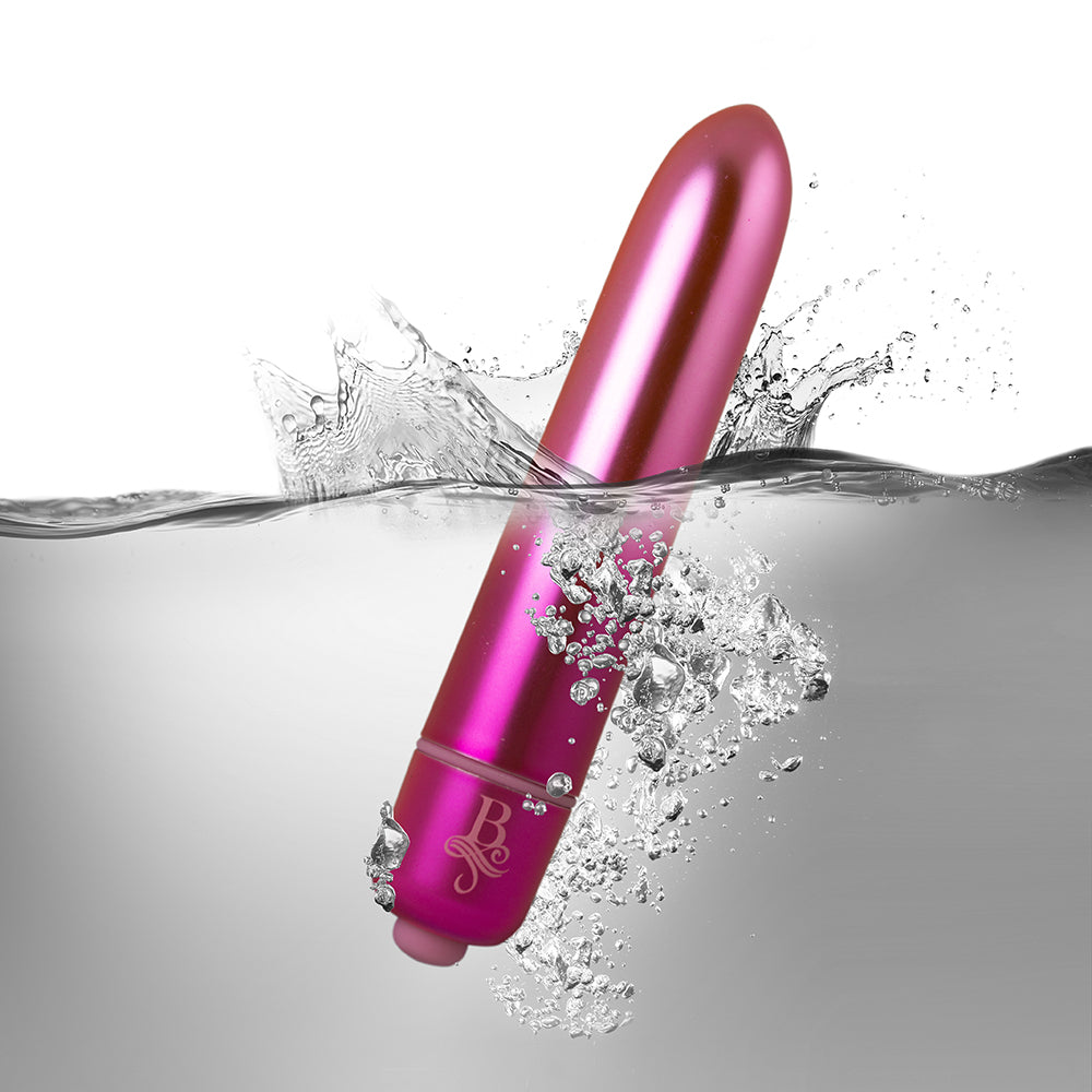 Pink Rocks Off bullet vibrator submerged in water.