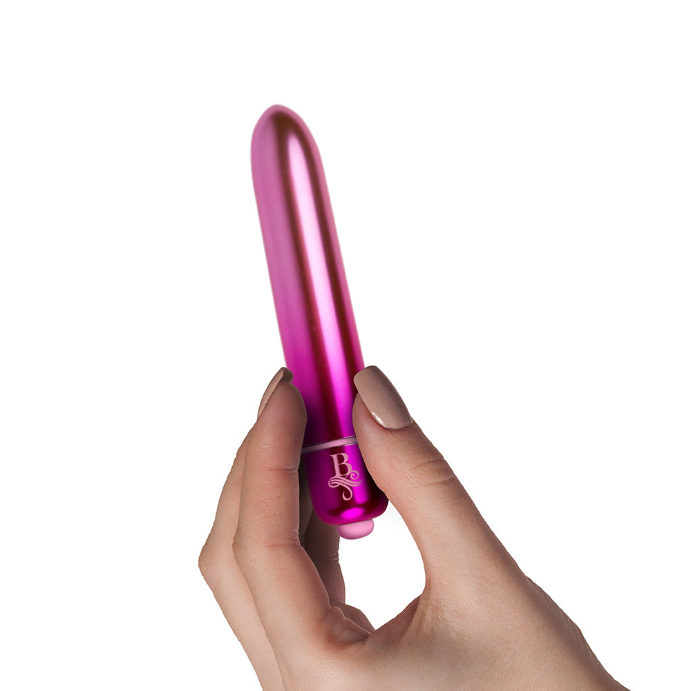 Rocks Off Boudoir Courtesan Bullet vibrator, held in a hand. A cheeky little thrill seeker!
