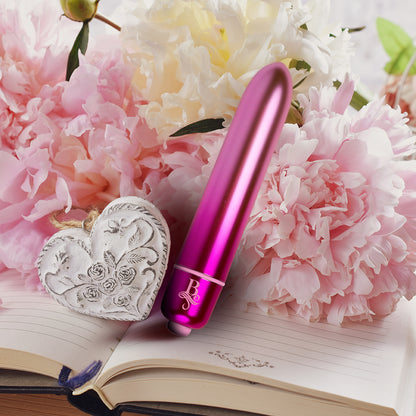 Rocks Off Boudoir Bullet vibrator amidst peonies, open journal and decorative heart.