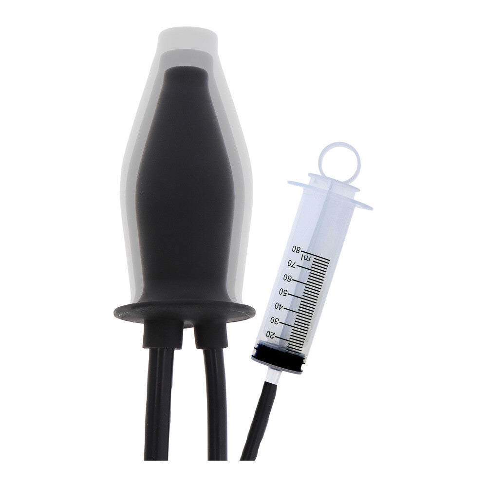 Black lubricating plug with a clear reservoir and syringe.