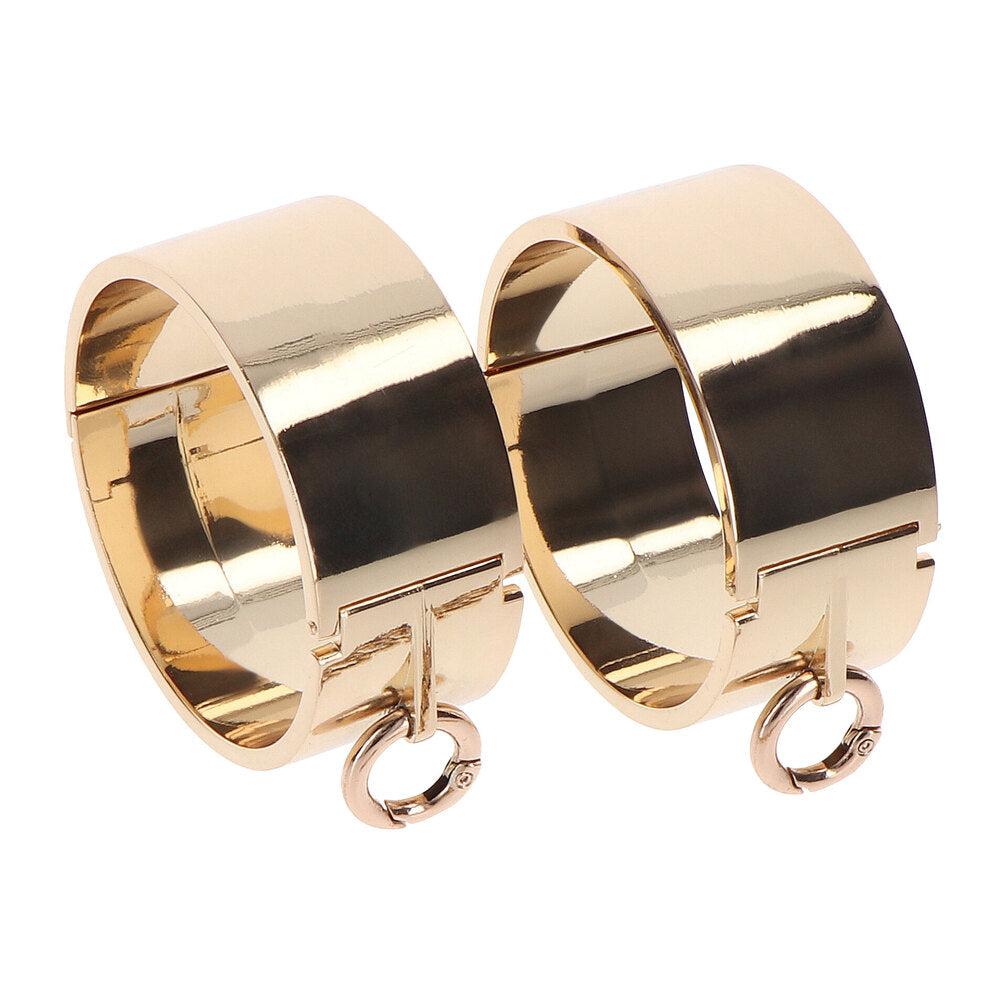Gold-toned metal wrist cuffs from Taboom.