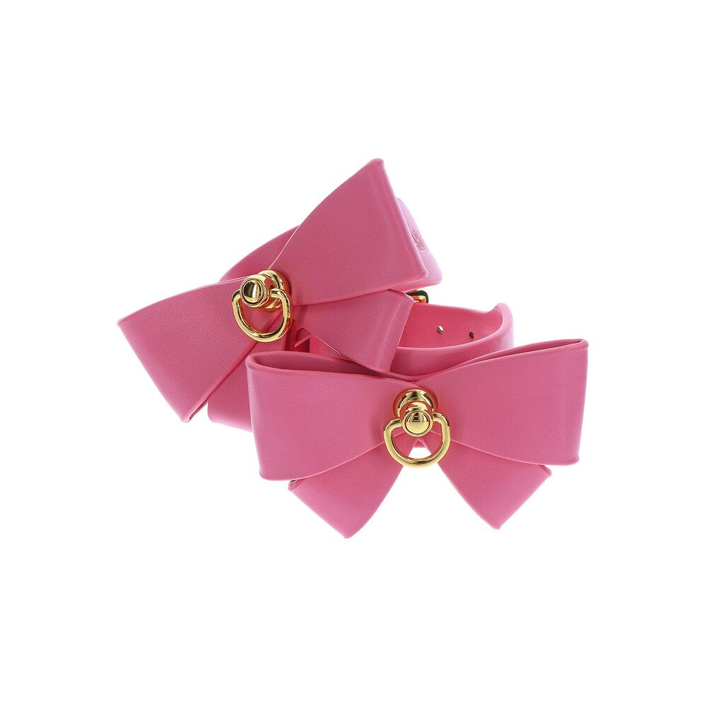 Pink Taboom Malibu wrist cuffs with gold O-ring detail.