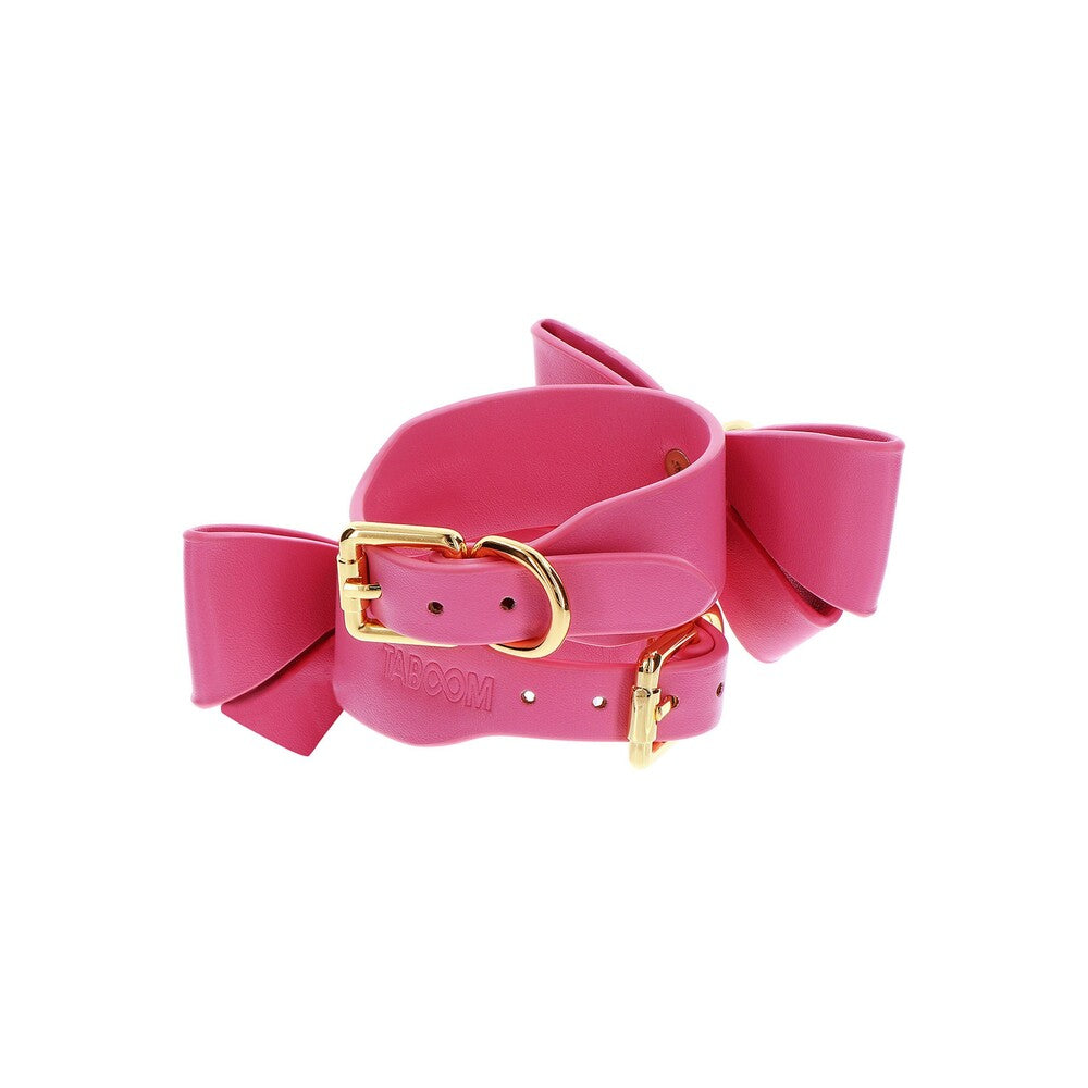 Pink Taboom Malibu wrist cuffs with gold buckles.