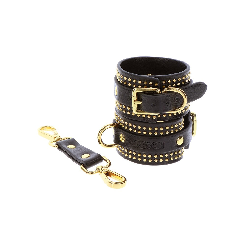 Taboom Vogue black studded ankle cuffs with gold hardware.