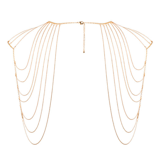 Glimmering gold shoulder jewellery. Drape yourself in delicate chains, a playful adornment.