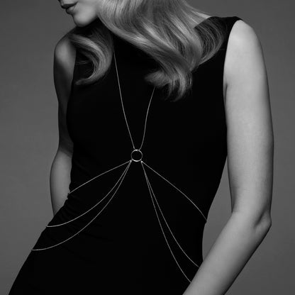 Delicate gold body chain. An intimate treasure worn against the skin, offering a thrill of subtle power.