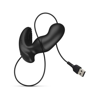 Black Nexus prostate massager with textures and USB charging cable.
