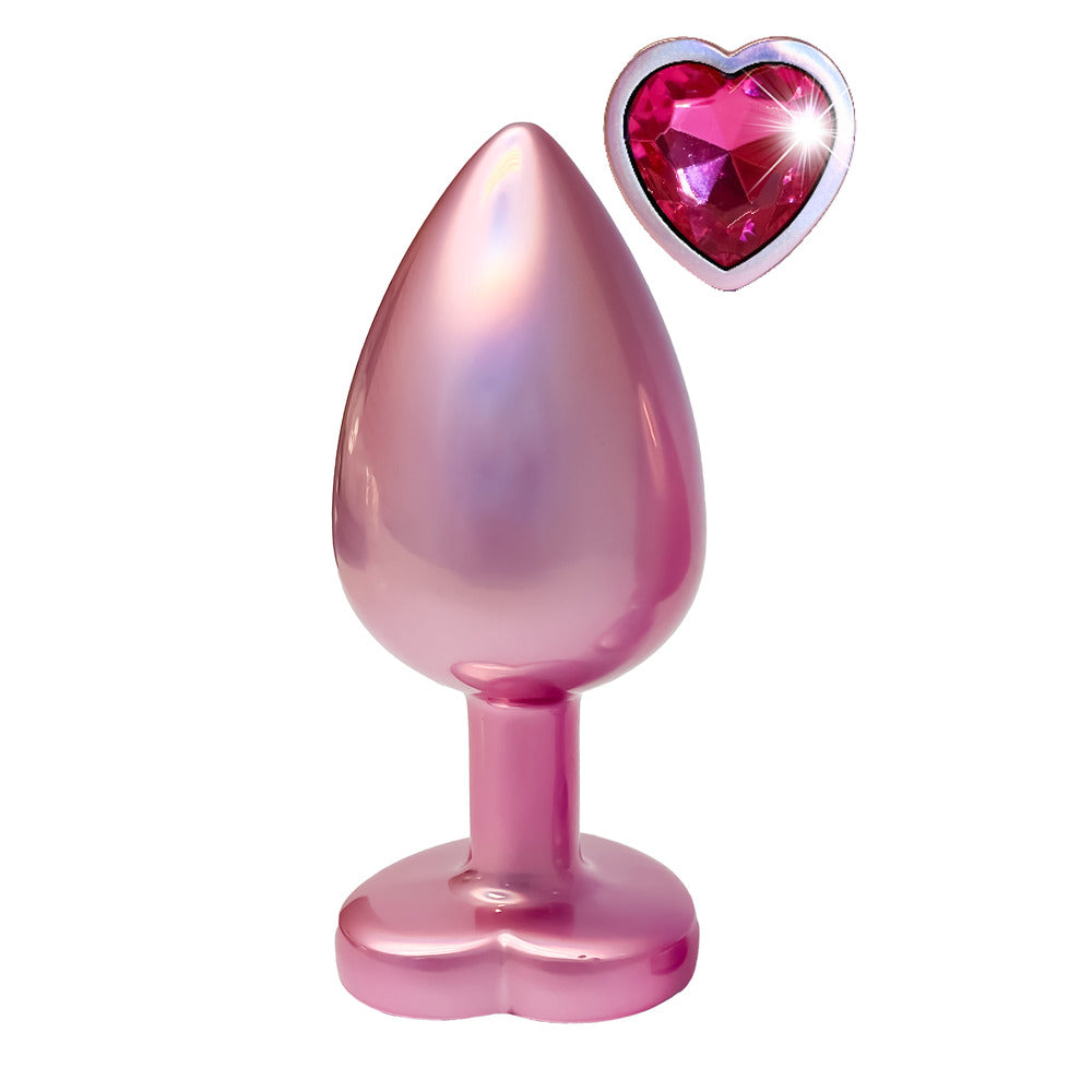 Pink pearlescent butt plug with heart gem