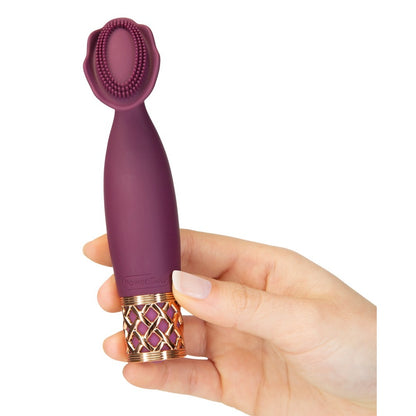 Purple mini massager held in hand