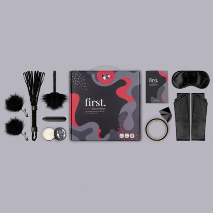 Kinky starter set with toys, restraints, flogger, and blindfold.