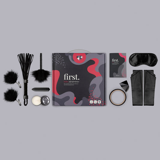 Kinky starter set with toys, restraints, flogger, and blindfold.