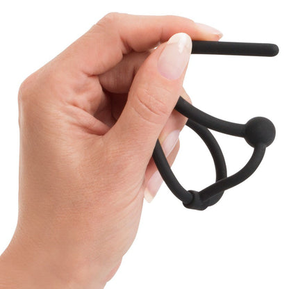 Hand holding a You2Toys black penis plug with glans ring