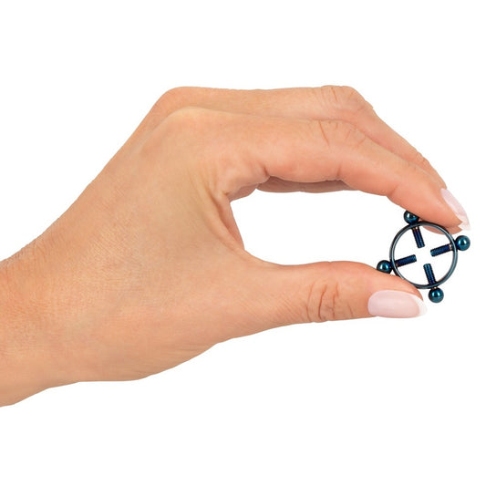 Blue Moon nipple jewellery, coolly held, hints at playful secrets yet to be revealed.
