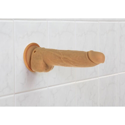 Caramel dildo with suction cup base, ready for cheeky fun on the tiles.
