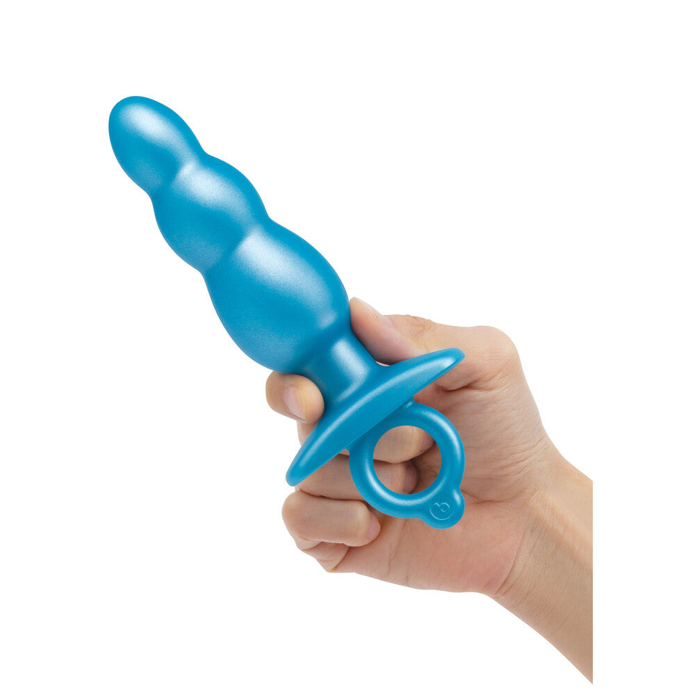 Blue B-Vibe Bounce Plug held in hand.