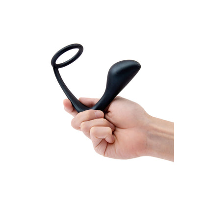 Hand holding a B-Vibe Ringer cock ring and plug.