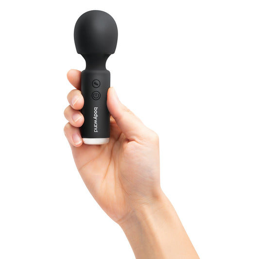 Bodywand Power Wand in black, held in hand. Pleasure awaits!
