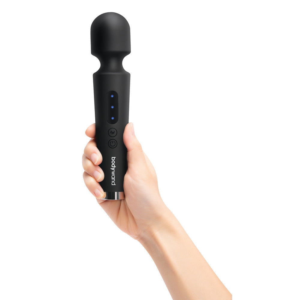 Bodywand Power Wand in black held playfully in hand.