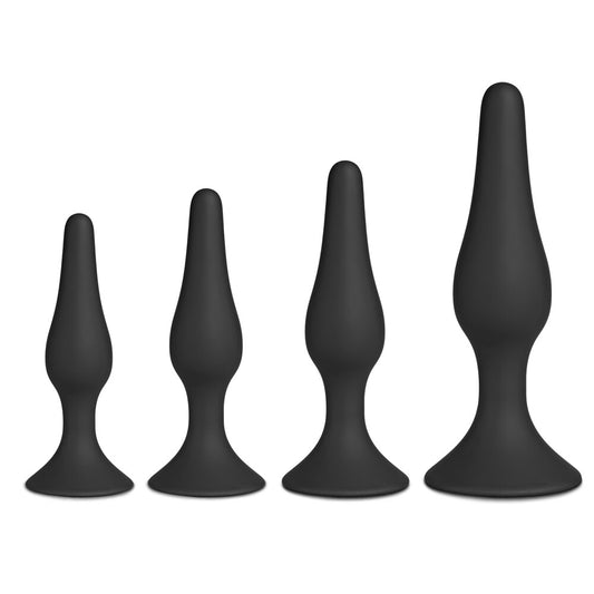 Four black silicone butt plugs of graduated sizes