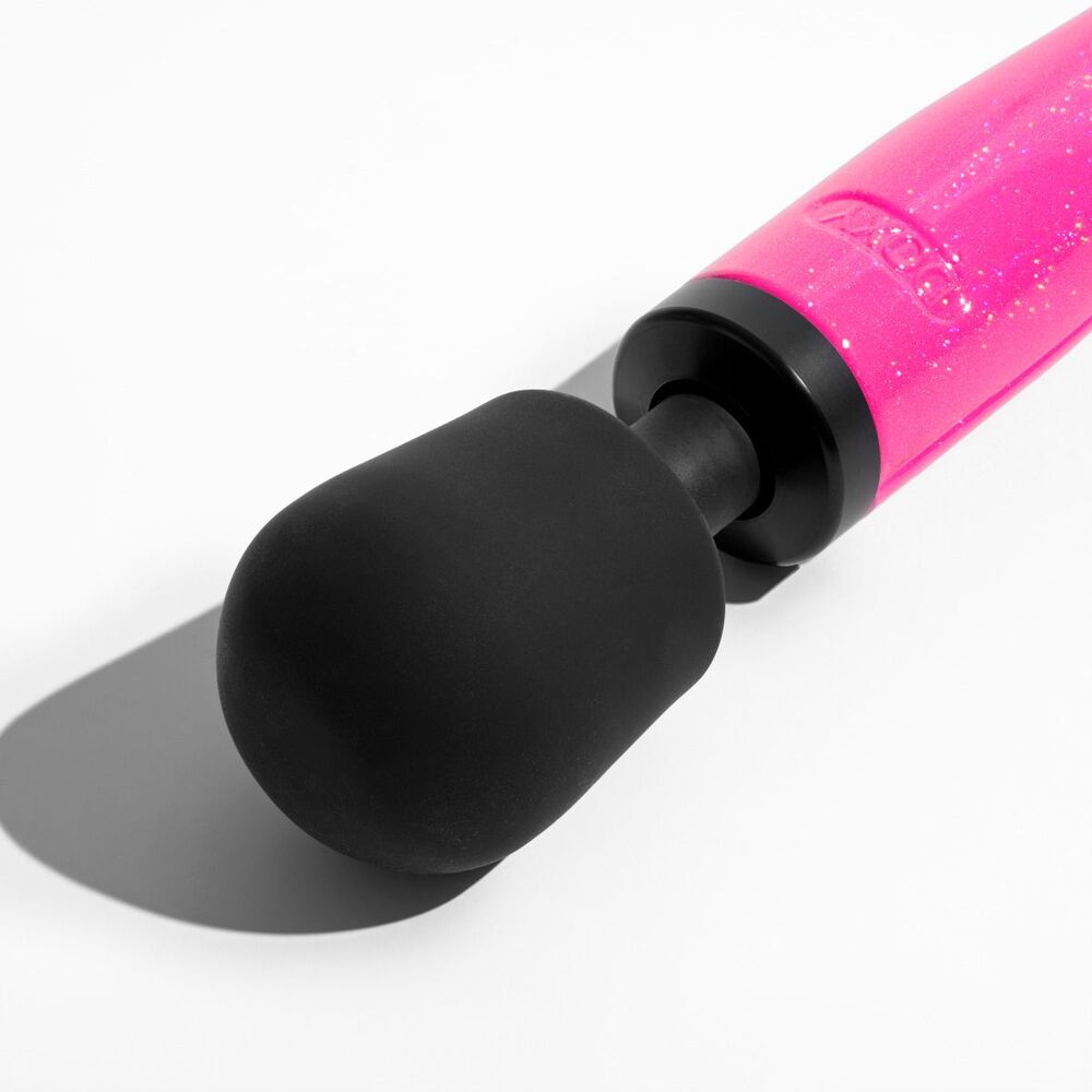 Hot pink Doxy wand massager for blissful moments.
