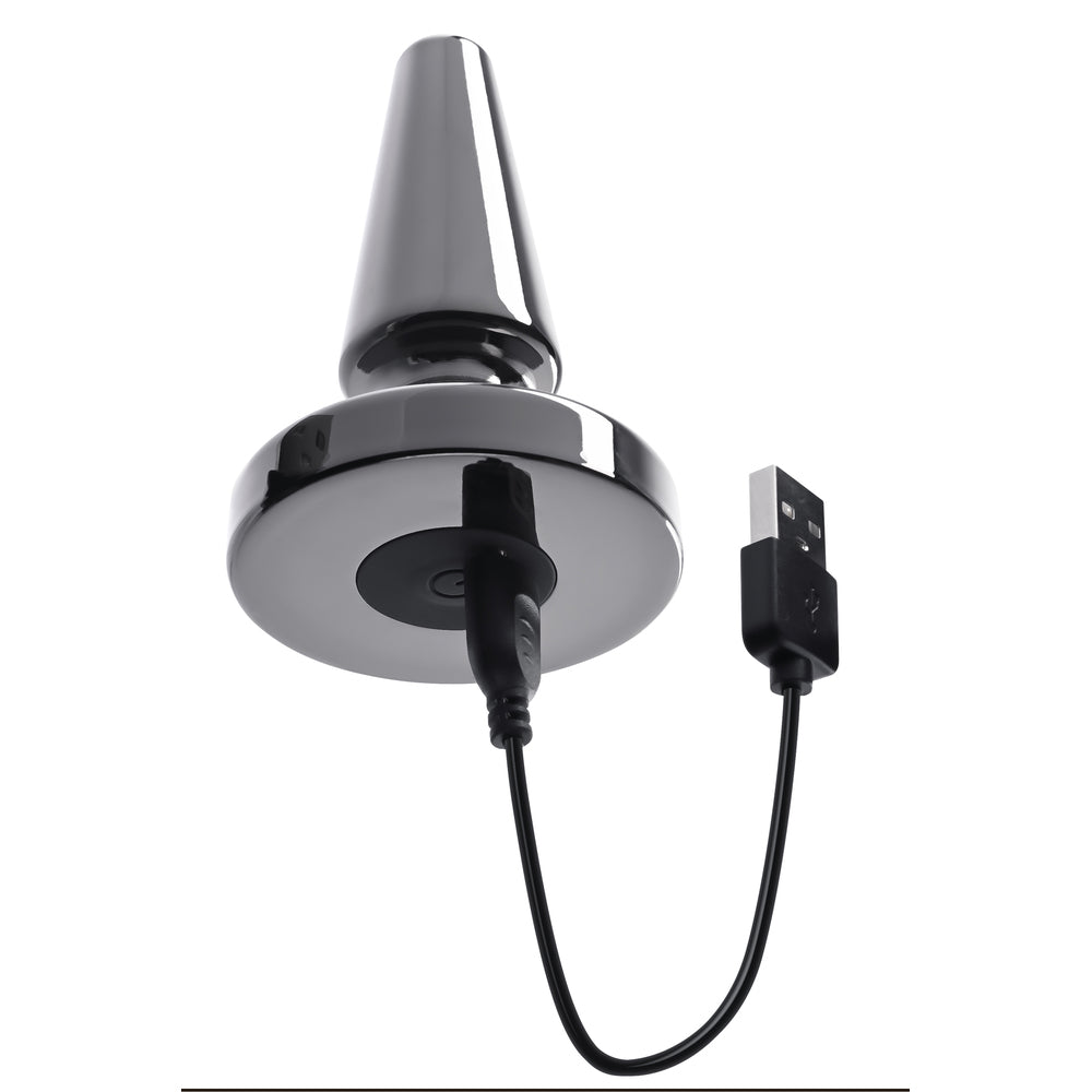 Metal vibrating plug from Evolved with charging cable for pleasure and exploration.