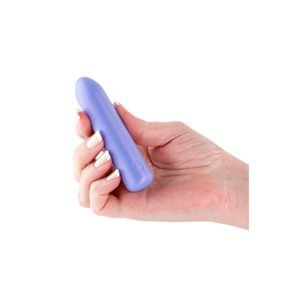 Hand holding a purple bullet vibrator.