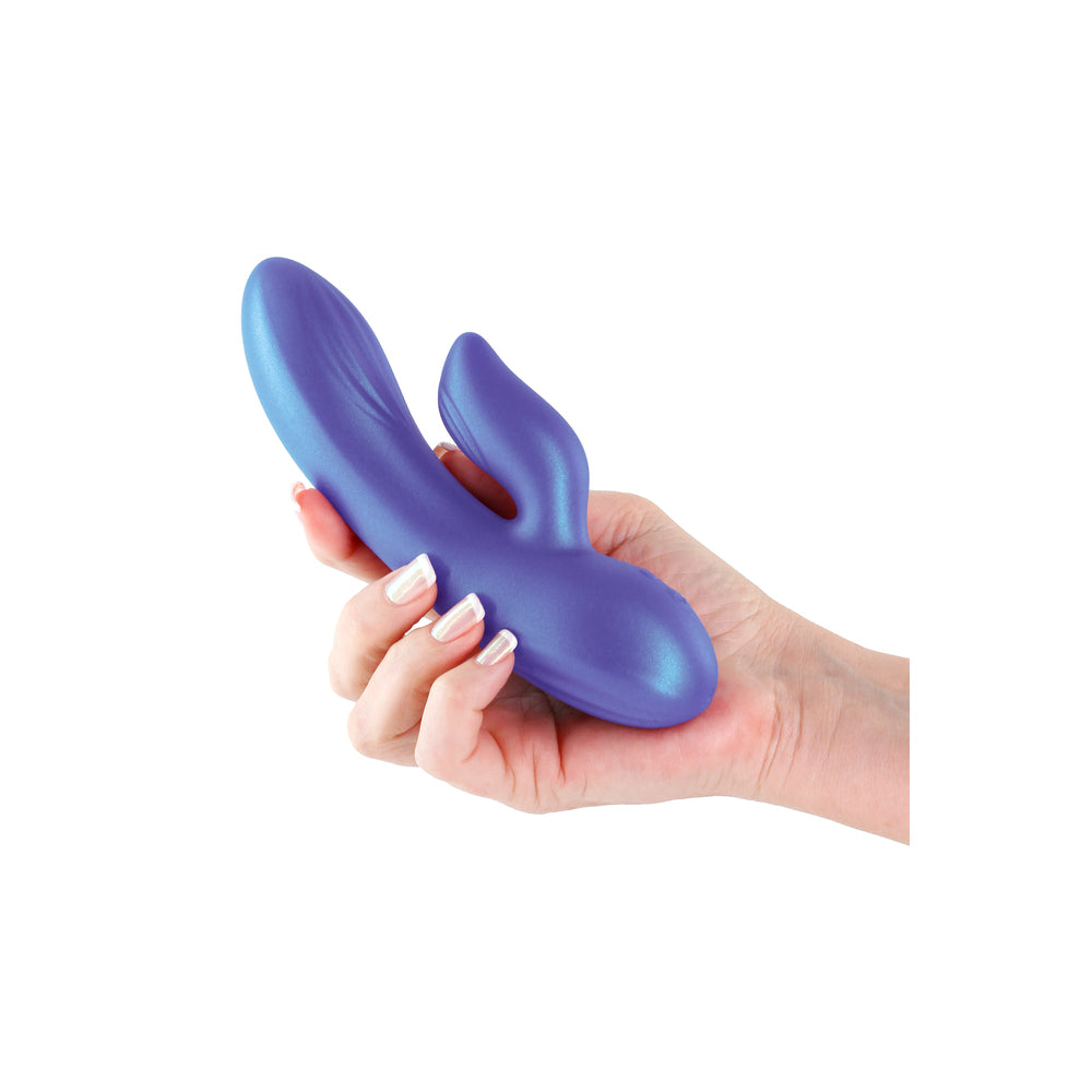 A hand holding a purple dual-stimulation vibrator.
