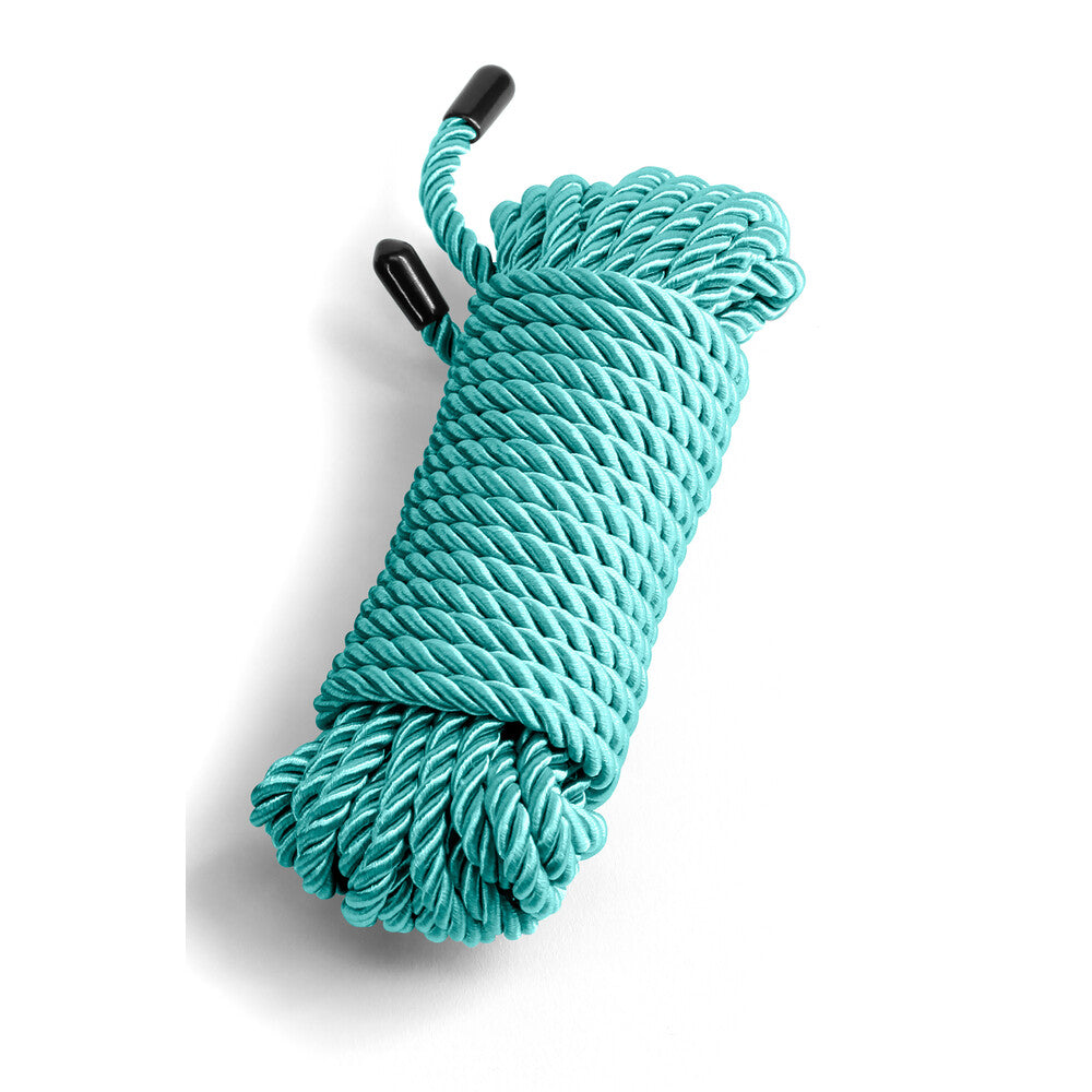 Teal temptation, neatly coiled. A silky promise of playful restraint, ready to explore your desires.