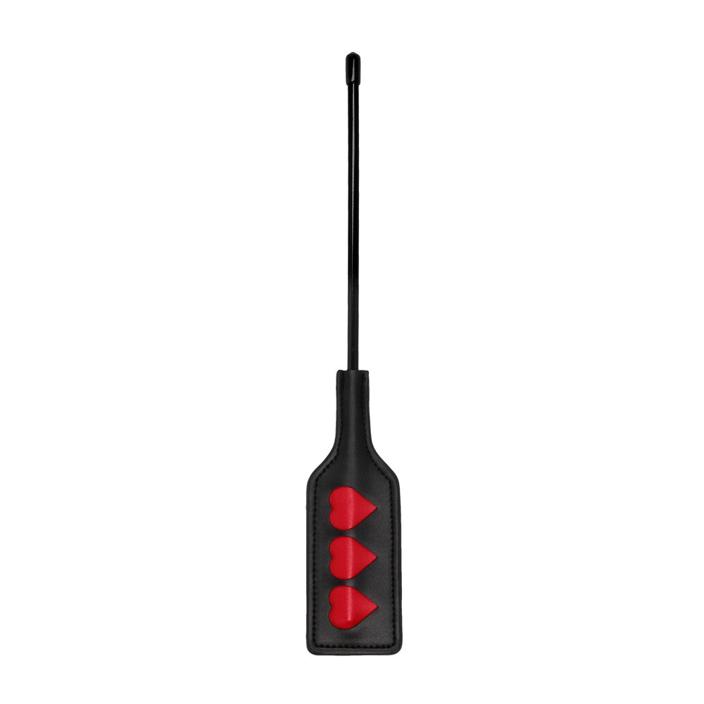 Black paddle with three red hearts