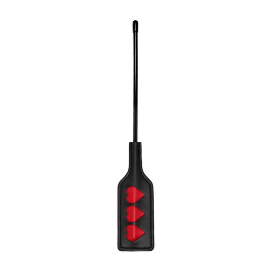 Black paddle with three red hearts
