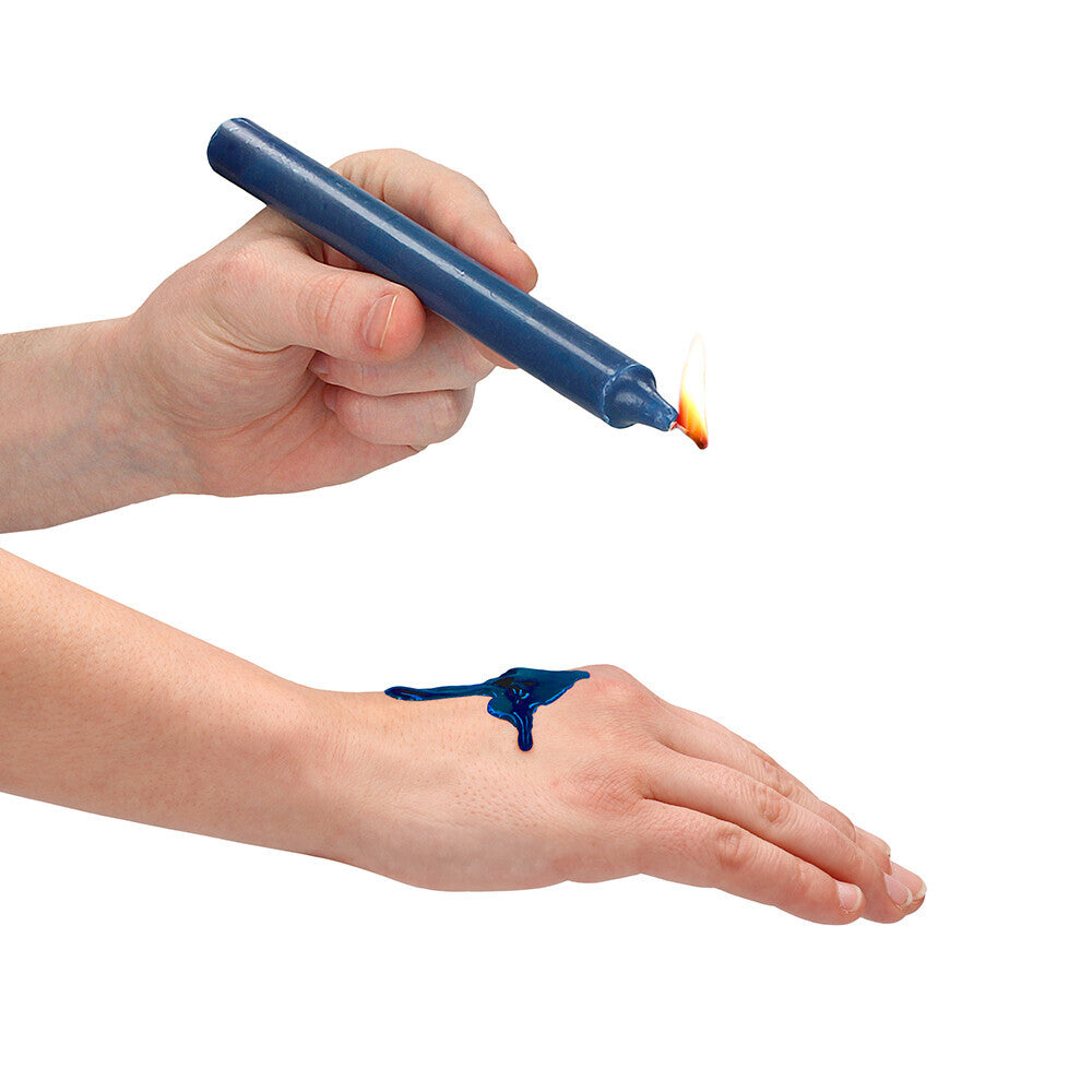 Wax play candle dripping blue wax on hand.